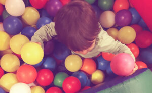 Ball pit child