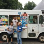 youth and adult in front of ice cream truck