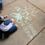 youth doing chalk drawing